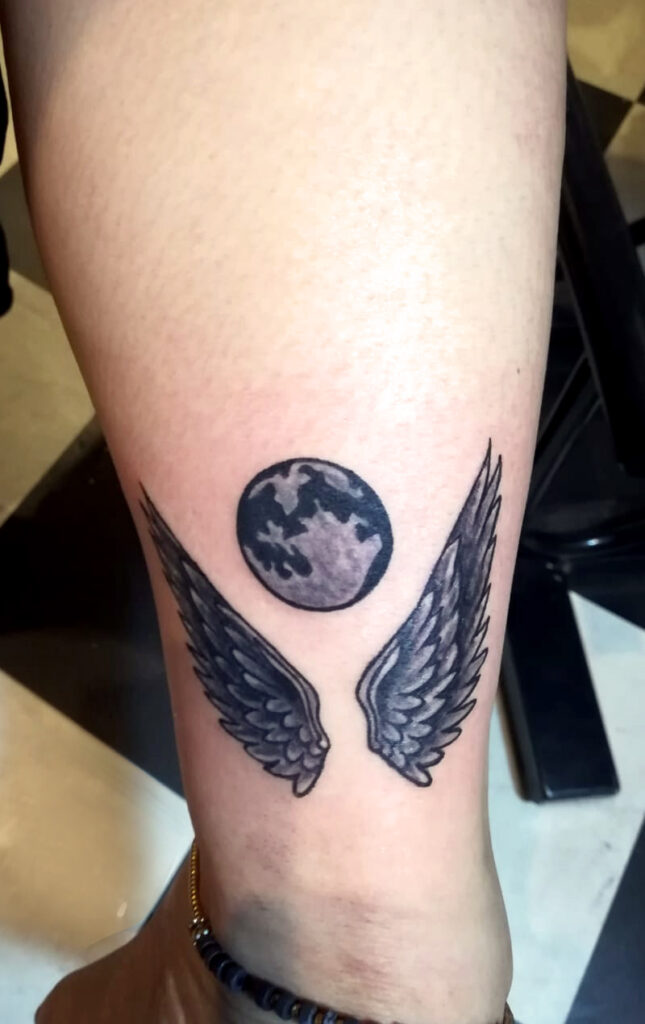 Wing with earth Tattoo Designs- Bob Tattoo Studio