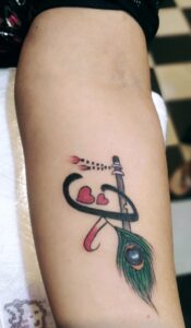 Flute with Feather Tattoo Designs- Bob Tattoo Studio